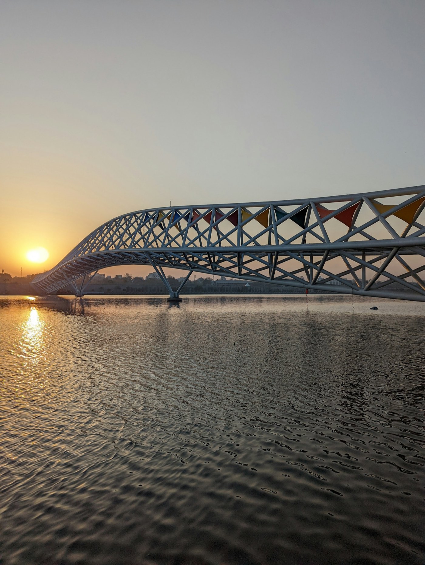 The Atal Bridge over the Sabarmati riverfront in Ahmedabad at sunset