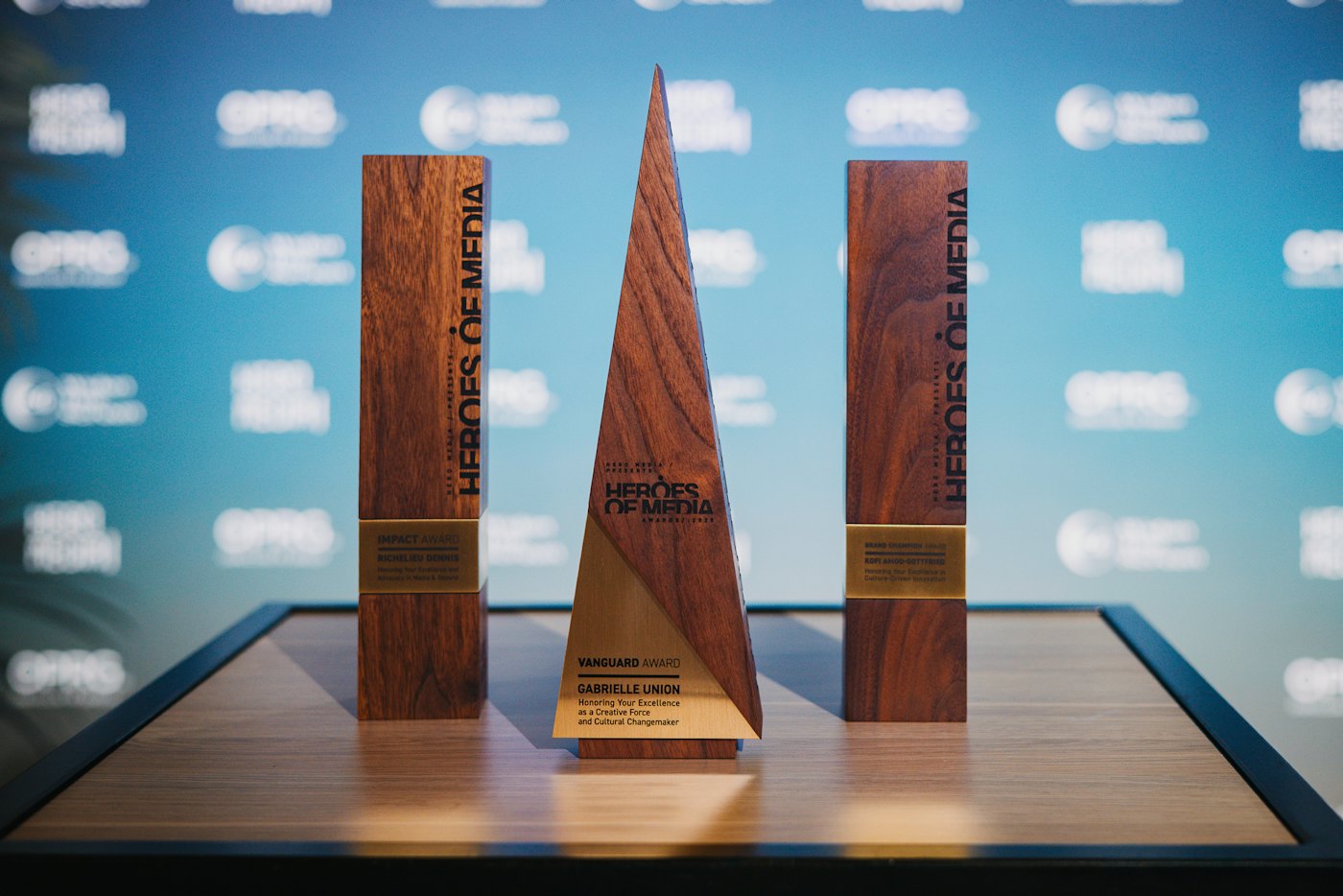 A row of wooden award trophies on a table